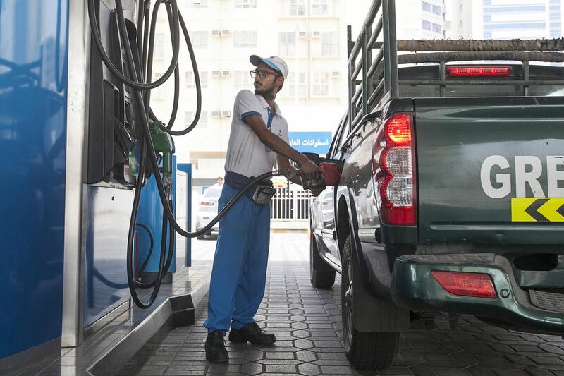 A vehicle fills up at a fuel station in Abu Dhabi. Mona Al Marzooqi / The National