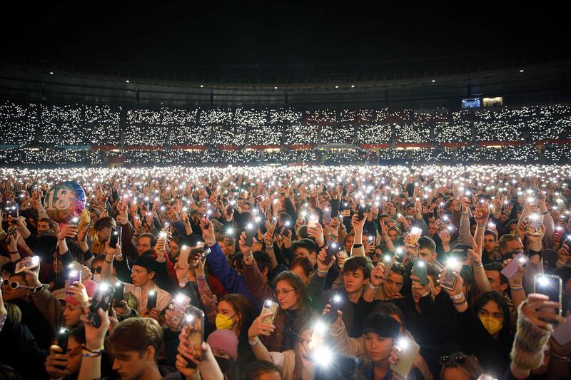 Participants illuminate the Ernst Happel Stadium in Vienna with the lights of their smartphones, during the charity concert We Stand with Ukraine. AFP