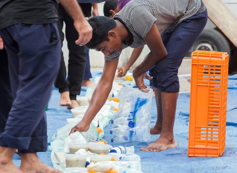 DUBAI,  UNITED ARAB EMIRATES, 20 May 2018 - Muslims are preparing the area around the mosque for the iftar at Lootah Masjid Mosque, Deira, Dubai. Leslie Pableo for The National  for Ramola Talwar story