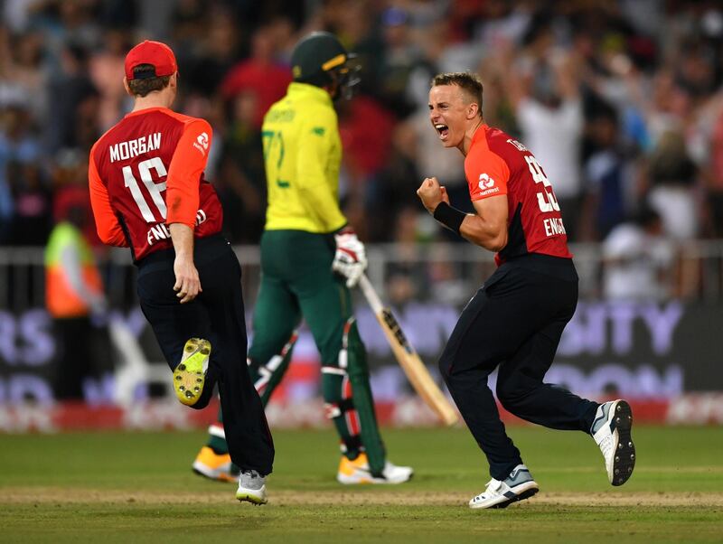 DURBAN, SOUTH AFRICA - FEBRUARY 14: Tom Curran of England celebrates the final wicket with teammate Eoin Morgan during the Second T20 International match between England and South Africa at Kingsmead Stadium on February 14, 2020 in Durban, South Africa. (Photo by Dan Mullan/Getty Images)