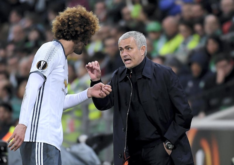 Manchester United's Portuguese coach Jose Mourinho (R) talks with Manchester United's Britain midfielder Daley Blind during the UEFA Europa League football match between AS Saint-Etienne and Manchester United on February 22, 2017, at the Geoffroy Guichard stadium in Saint-Etienne, central France. / AFP PHOTO / PHILIPPE DESMAZES