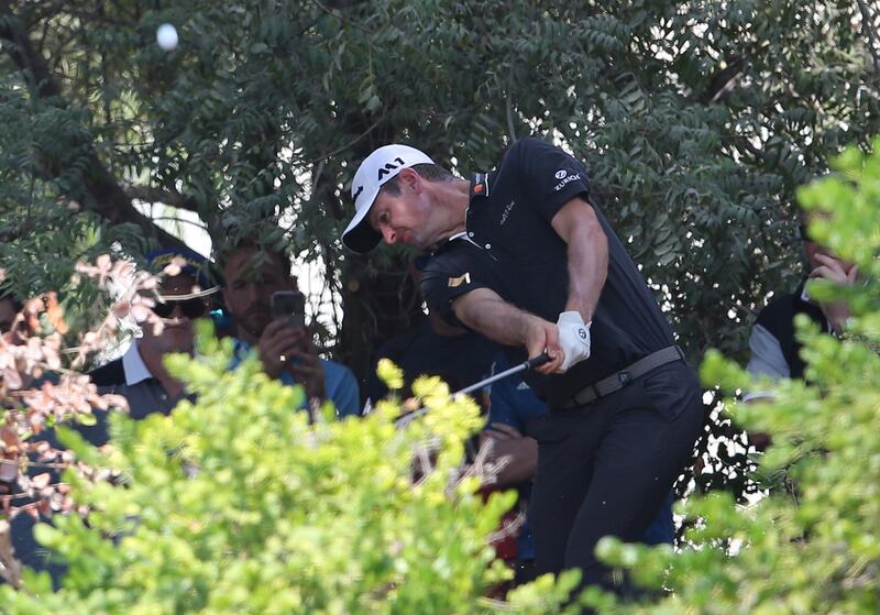 Justin Rose plays a shot on the bush of 2nd hole during the second round of the DP World Tour Championship. Kamran Jebreili / AP Photo