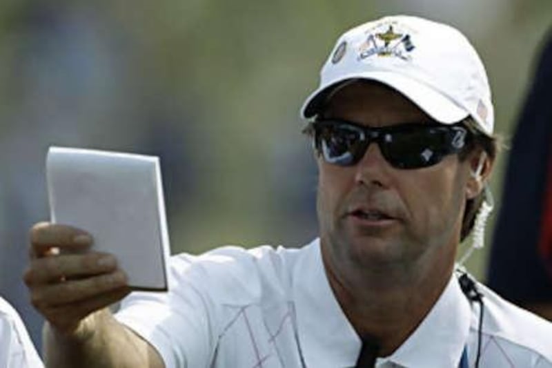 United States team captain Paul Azinger checks his notes on the 17th fairway during the opening round of the Ryder Cup golf tournament at the Valhalla Golf Club, in Louisville on Sept 19 2008.
