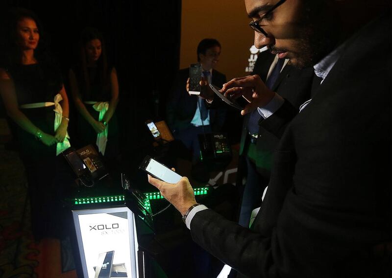 Customers choeck out Xolo Android smartphones during their launch in Dubai. Satish Kumar / The National