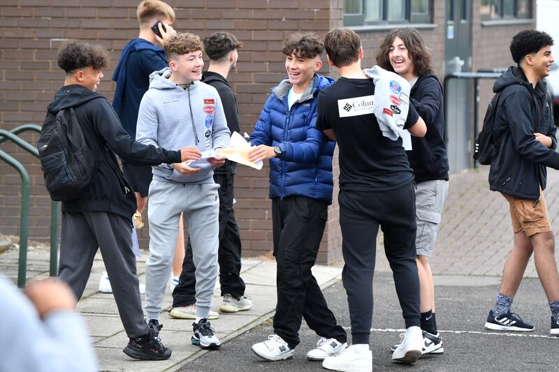 HYDE, ENGLAND - AUGUST 25: Students receive their GCSE results at Longdendale High School on August 25, 2022 in Hyde, Greater Manchester, England. This year's candidates are the first to sit exams since 2019 due to the Covid-19 pandemic and the results will likely reflect the impact of the pandemic on the nation's schoolchildren. (Photo by Anthony Devlin/Getty Images)