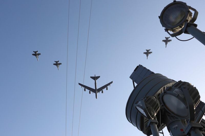 The Abraham Lincoln Carrier Strike Group and a US Air Force B-52H Stratofortress, assigned to the 20th Expeditionary Bomb Squadron and part of the Bomber Task Force deployed to the region, conducting joint exercises in the US Central Command area of responsibility, in the Arabian Sea.   EPA