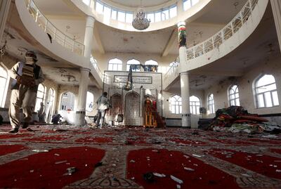 ATTENTION EDITORS - VISUAL COVERAGE OF SCENES OF DEATH AND INJURY Afghan men inspect inside a Shi'ite Muslim mosque after last night's attack in Kabul, Afghanistan October 21, 2017.  REUTERS/Omar Sobhani