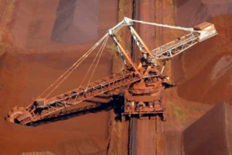 A bucket wheel reclaimer collects ore at the BHP Billiton iron ore loading facility in Port Hedland, about 1,600 km (960 miles) north of Perth, in this May 26, 2008 file photo. Top global miner BHP Billiton walked away from its $58 billion hostile offer for rival Rio Tinto on November 25, 2008, citing worsening market conditions and European regulators' demands it sell prized iron ore and coal assets.           REUTERS/Tim Wimborne/Files     (AUSTRALIA) *** Local Caption ***  SIN101_RIO-BHP-_1125_11.JPG