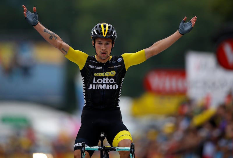 epa06914193 Team Lotto NL Jumbo rider Primoz Roglic of Slovenia celebrates as he crosses the finish line to win the 19th stage of the 105th edition of the Tour de France cycling race over 200.5km between Lourdes and Laruns, France, 27 July 2018.  EPA/KIM LUDBROOK