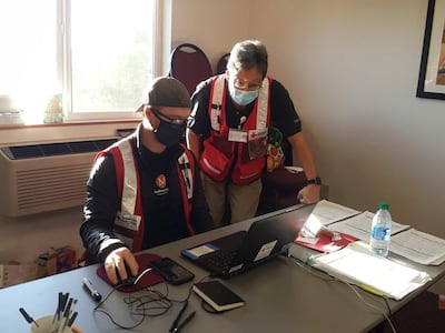Alan Henzy and an emergency doctor working in Oregon. Courtesy Red Cross