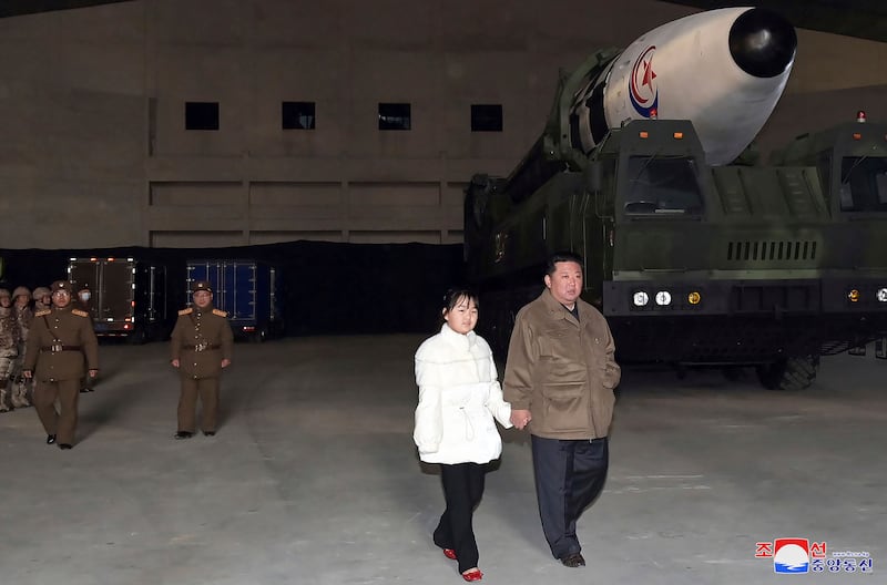 North Korean leader Kim Jong-un and a girl purported to be his daughter inspect a ballistic missile at Pyongyang International Airport. AP