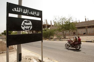 An Al Qaeda logo is seen on a street sign in Abyan province in 2012, before government forces drove the militants out of most of the southern province. AP Photo