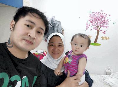 Richard Romarate is looking for another job to help him continue to stay in the UAE along with his wife Lanie La Candola so they can care for their daughter Rickiella. Food supplies for badminton groups in Dubai have taken some pressure off the family. Courtesy: Richard Romarate