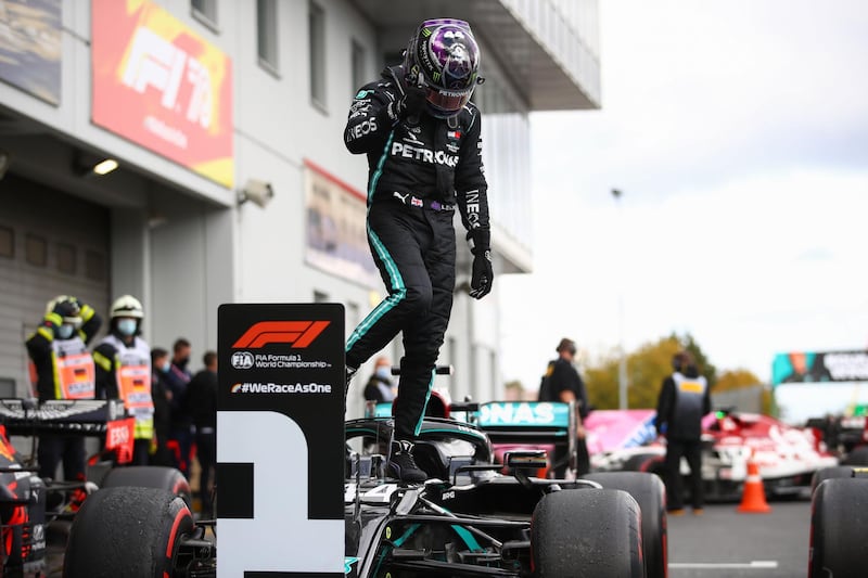 Race winner Lewis Hamilton gets out of his car after winning the Eifel Grand Prix. AFP