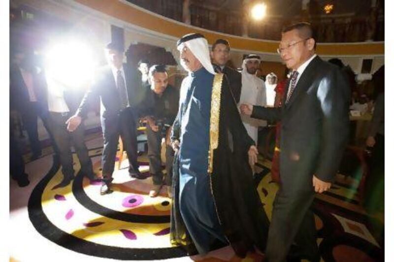 Sheikh Hasher bin Maktoum Al Maktoum, the Director General of the Dubai Department of Information, left, and Sun Yusheng, the vice president of China Central Television, at the Burj Al Arab.