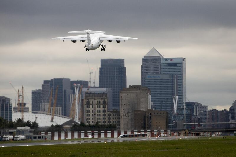 A passenger aircraft, operated by CityJet Ltd., takes off towards the Canary Wharf financial, business and shopping district at London City Airport (LCY), in London, U.K., on Tuesday, Aug. 8, 2017. The chief Brexit concern of carriers is to maintain a single market for air travel which would allow existing routes between Britain and the EU to continue. Photographer: Simon Dawson/Bloomberg