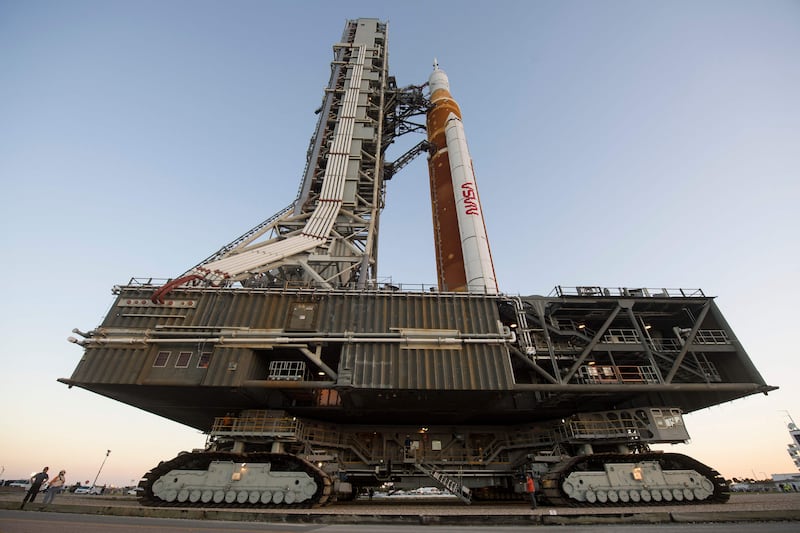 Nasa's massive new rocket began its first journey to a launchpad ahead of a battery of tests. AFP