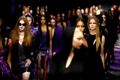 Models present creations for the latest collection by Versace called "a goddess gone gothic". EPA