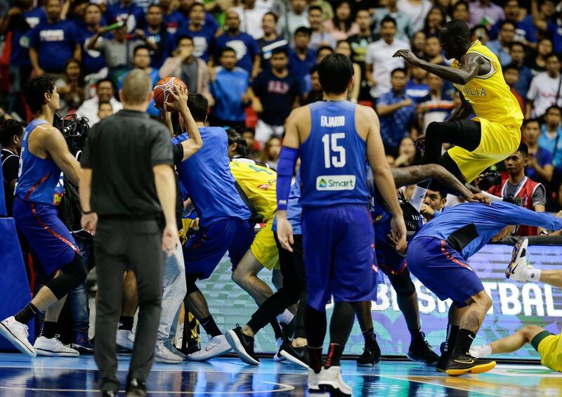 A brawl erupts between players from the Philippines, in blue, and Australia during their Fiba Basketball World Cup 2019 Group B qualifier in Manila. Mark R. Cristino / EPA