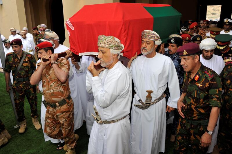 Oman's newly sworn-in Sultan Haitham bin Tariq Al Said carries the coffin of his cousin, Sultan Qaboos, during the funeral in Muscat. Reuters
