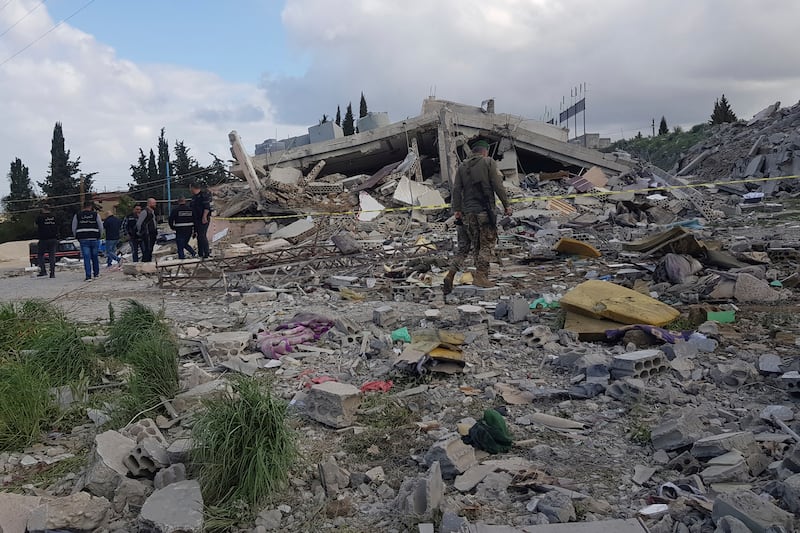 Lebanon's security force inspects the damage after an explosion in the town of Banaafoul near the port city of Sidon. AP