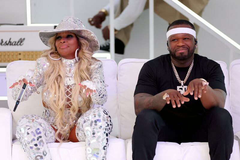 Mary J Blige and 50 Cent share a moment during the Super Bowl Halftime Show. Getty