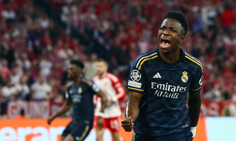 Vinicius Junior celebrates after scoring the equaliser for Real Madrid at the Allianz Arena. EPA