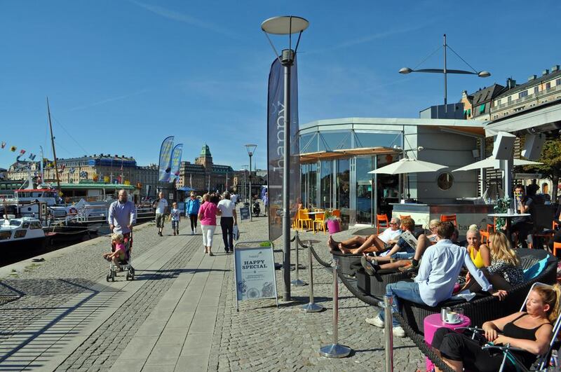 Locals enjoy sunshine on the central Stockholm's waterfront. (Photo by Rosemary Behan)