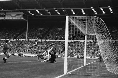 Ajax's Johan Cruyff scores in the 1971 European Cup final against Panathinaikos at Wembley. Cruyff and Ajax would complete a treble the following season. AP Photo / June 2, 1971