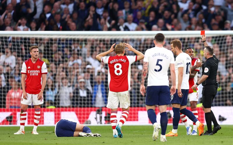 Arsenal's Rob Holding is shown a red card following a foul on Son Heung-Min. Getty