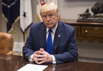 U.S. President Donald Trump listens during a meeting with congressional leadership in the Roosevelt Room of the White House in Washington, D.C., U.S., on Tuesday, Nov. 28, 2017. The path to a year-end spending deal is getting more difficult as Trump butts heads with lawmakers and Democrats disagree over whether to threaten a government shutdown to protect young undocumented immigrants from deportation. Photographer: Kevin Dietsch/Pool via Bloomberg