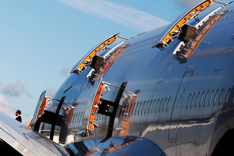 A visitor, lower left, walks out from an Airbus A380 on display at the Farnborough International Airshow. AP