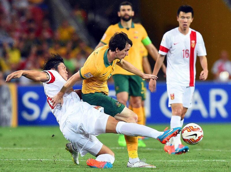 Robbie Kruse, centre, in action against China in the Asian Cup quarter-finals. Kruse insists Australia are preparing for a "tough" match against the UAE. Dave Hunt/EPA 