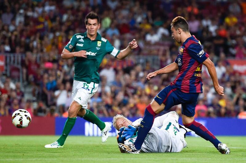 Munir El Haddadi of Barcelona scores his team's fourth goal against Leon on Monday night in a friendly. David Ramos / Getty Images  
