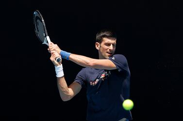 MELBOURNE, AUSTRALIA - JANUARY 12: Novak Djokovic of Serbia plays a backhand shot during a practice session ahead of the 2022 Australian Open at Melbourne Park on January 12, 2022 in Melbourne, Australia. (Photo by Darrian Traynor / Getty Images)