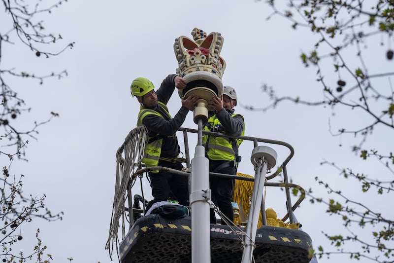 A crown is placed on top of a flagpole on The Mall in London. Getty Images