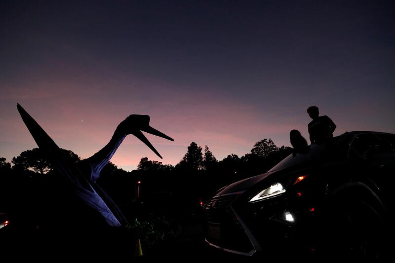 People drive through the Jurassic Quest Experience outside The Rose Bowl Stadium in Pasadena, California, US. Reuters