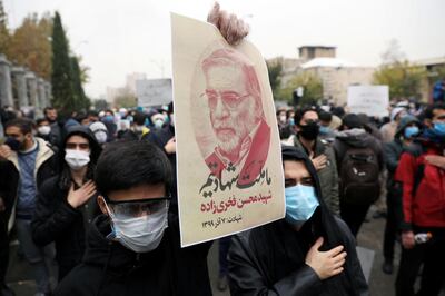 A protester holds a picture of Mohsen Fakhrizadeh, Iran's top nuclear scientist, during a demonstration against his killing in Tehran, Iran, November 28, 2020. Majid Asgaripour/WANA (West Asia News Agency) via REUTERS ATTENTION EDITORS - THIS IMAGE HAS BEEN SUPPLIED BY A THIRD PARTY.
