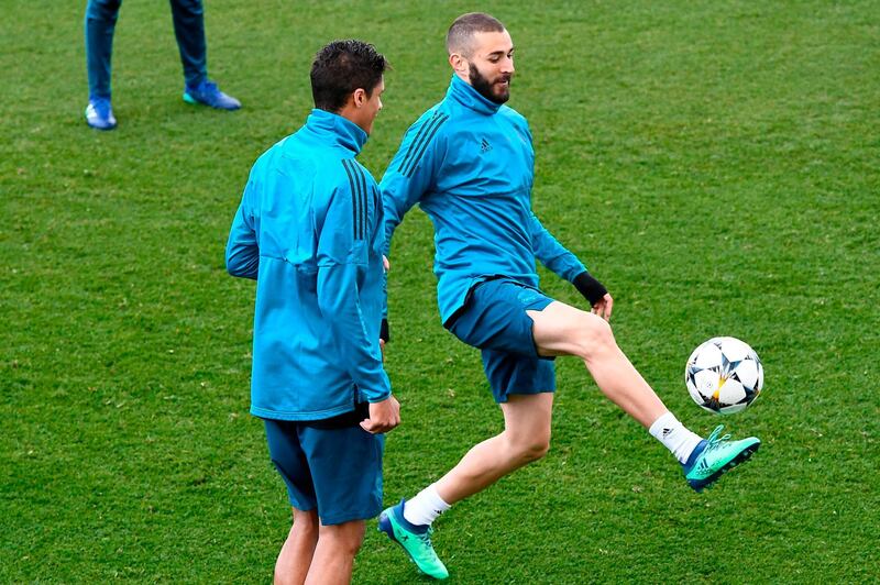 Real Madrid's striker Karim Benzema, right, defender Raphael Varane take part in a training session. Gabriel Bouys / AFP