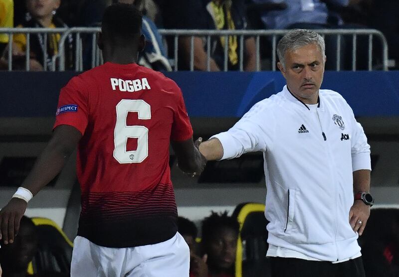 Paul Pogba shakes hands with Mourinho after his substitution during the UEFA Champions League group H football match between Young Boys and Manchester United on September 19, 2018. AFP