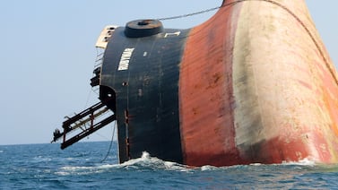 This picture taken on March 7, 2024 shows the Rubymar cargo ship partly submerged off the coast of Yemen.  The bulk carrier went down off Yemen after a Huthi missile attack and poses grave environmental risks as thousands of tonnes of fertiliser threaten to spill into the Red Sea, officials and experts warn.  The Belize-flagged, Lebanese-operated Rubymar sank on Saturday with 21,000 metric tonnes of ammonium phosphate sulfate fertiliser on board, according to US Central Command.  (Photo by Khaled ziad  /  AFP)