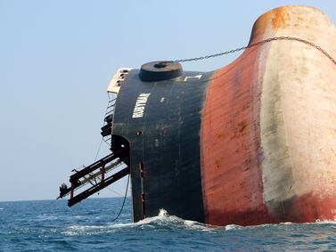 This picture taken on March 7, 2024 shows the Rubymar cargo ship partly submerged off the coast of Yemen.  The bulk carrier went down off Yemen after a Huthi missile attack and poses grave environmental risks as thousands of tonnes of fertiliser threaten to spill into the Red Sea, officials and experts warn.  The Belize-flagged, Lebanese-operated Rubymar sank on Saturday with 21,000 metric tonnes of ammonium phosphate sulfate fertiliser on board, according to US Central Command.  (Photo by Khaled ziad  /  AFP)