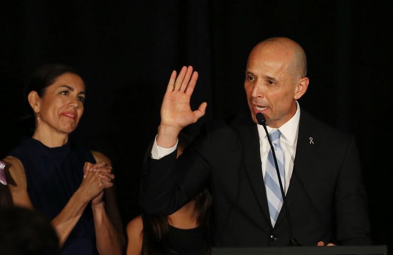 Democratic candidate for Arizona Governor David Garcia gives his concession speech as his wife, Lori, left, listens at an election-night gathering in Arizona. Garcia lost to Republican Gov. Doug Ducey. AP