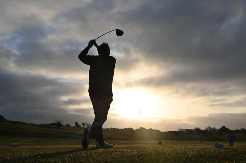 A player tees off from the first hole at Dyke Golf club in Brighton. AFP