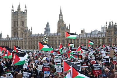 Protesters waving Palestinian flags crossed Westminster Bridge during their march to demand a ceasefire in Gaza. AFP 