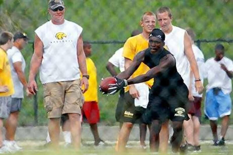 Brett Favre has been a fixture at Oak Grove High School for several summers, working with players during their summer practices.