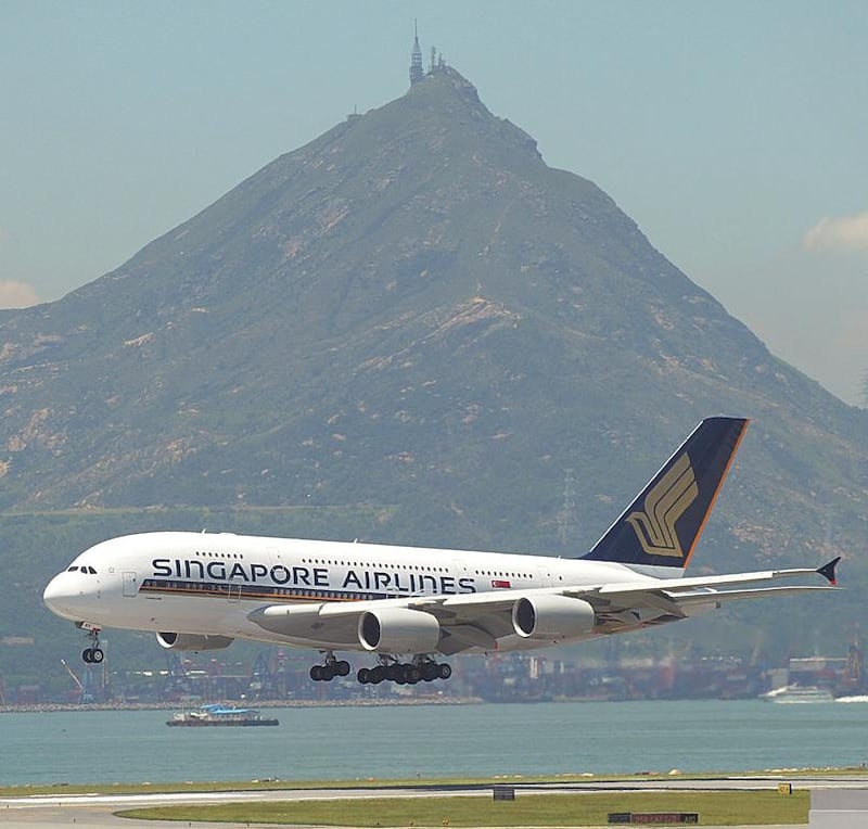 A Singapore Airlines aircraft comes in to land at Hong Kong's international airport. The carrier is to use an A350-900 on its service to Houston via Manchester. Mike Clarke / AFP
