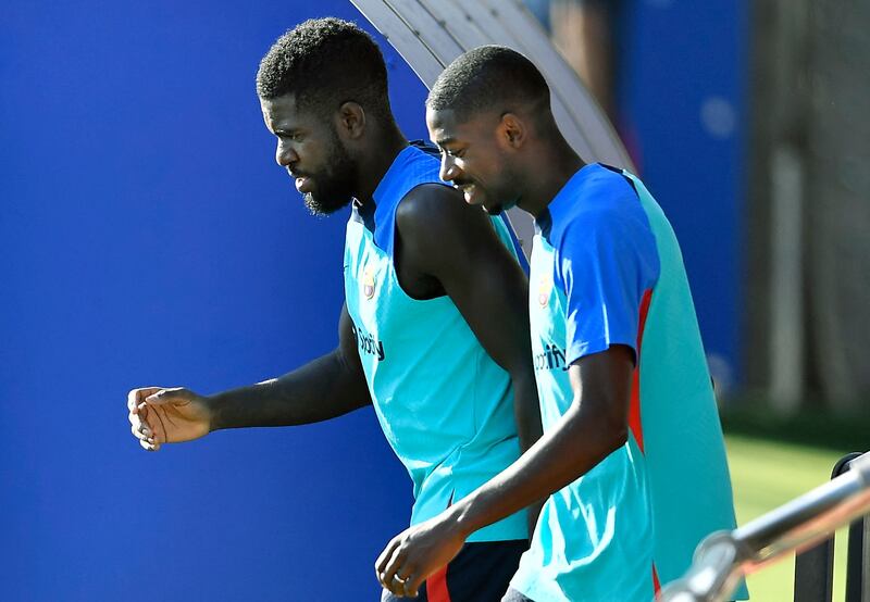 Samuel Umtiti and Ousmane Dembele arrive at the training session. AFP