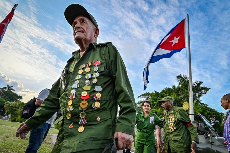 Cuban veterans participate in a parade commemorating the 65th anniversary of Fidel Castro's entry in Havana. AFP