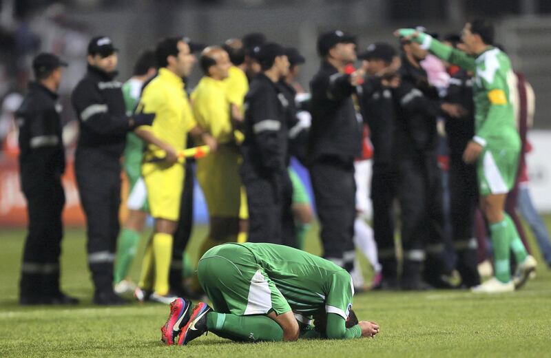 An Iraqi player reacts after his team lost the final of the 21st Gulf Cup on January 18, 2013 in Manama. United Arab Emirates won 2-1 against  Iraq.  AFP PHOTO/MARWAN NAAMANI
 *** Local Caption ***  291128-01-08.jpg